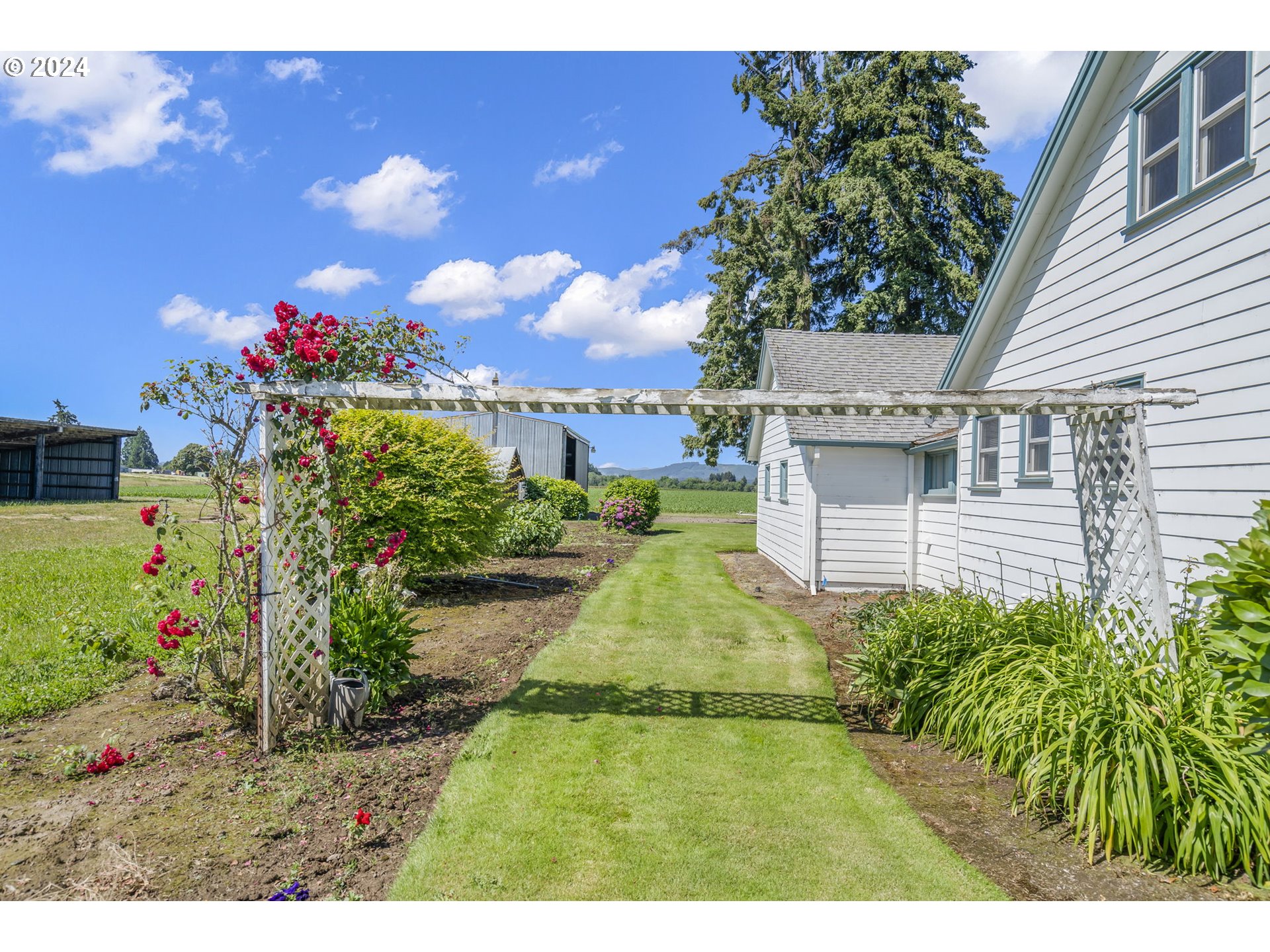 7075 Northwest Roy Road Cornelius, OR 97113 - Photo 38 of 48 a view of a house with a backyard