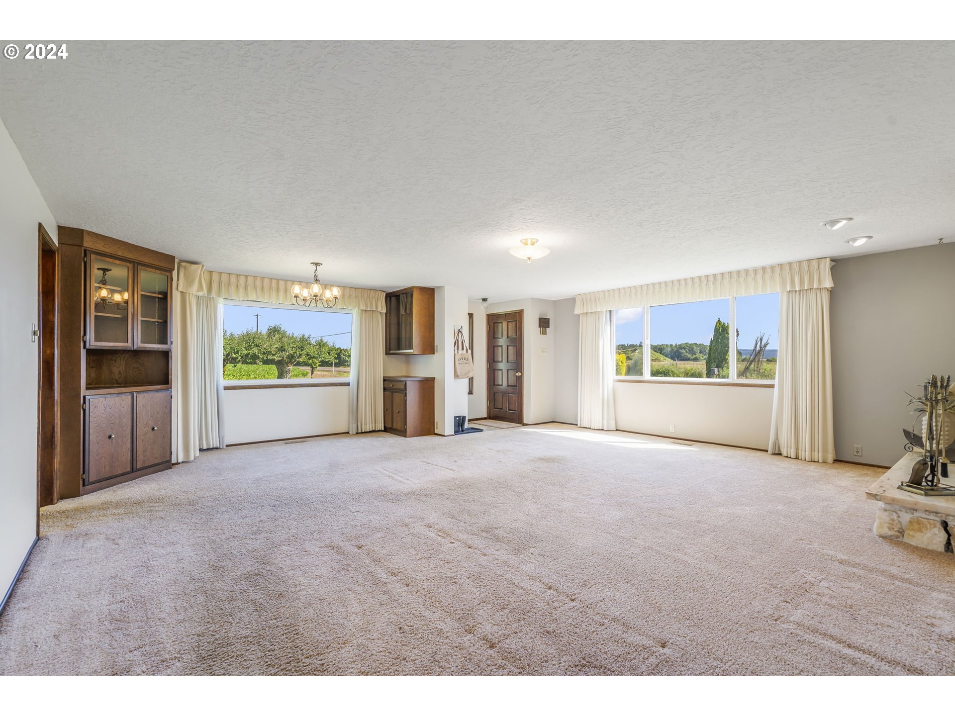 7075 Northwest Roy Road Cornelius, OR 97113 - Photo 7 of 48 a view of a big room with windows and kitchen view