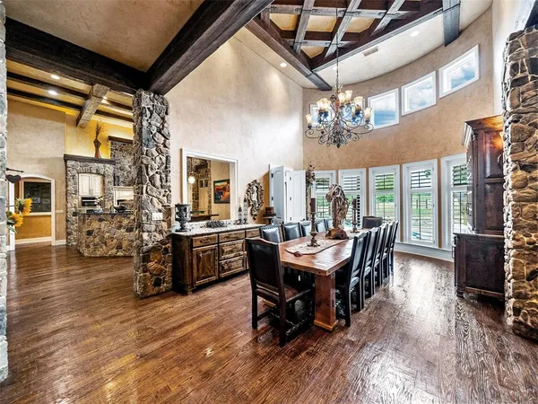 a living room with furniture a piano and a rug