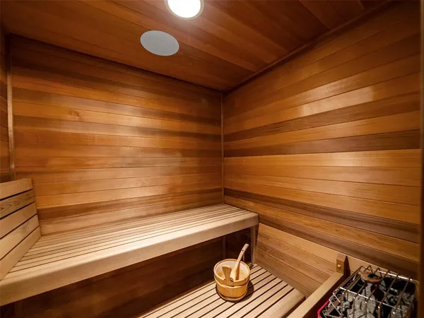 a room with a bed and wooden floor