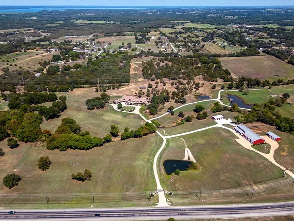 an aerial view of a pool yard swimming and lake view