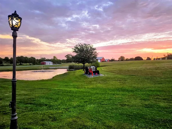 a view of a lake with a yard