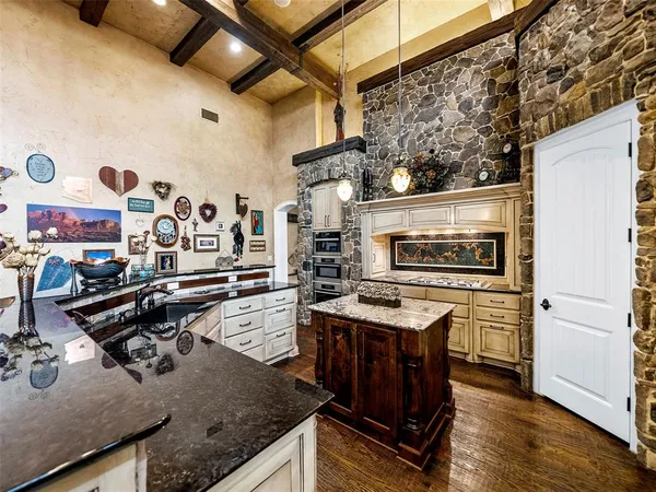 a view of a kitchen with furniture and a kitchen