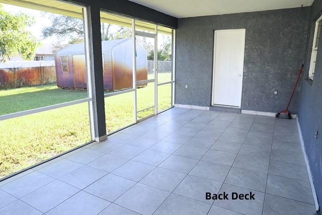 242 Southwest Parish Terrace Port St. Lucie, FL 34984 - Photo 11 of 14 a view of an empty room with a large window