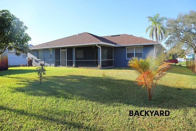 242 Southwest Parish Terrace Port St. Lucie, FL 34984 - Photo 13 of 14 a front view of a house with a yard