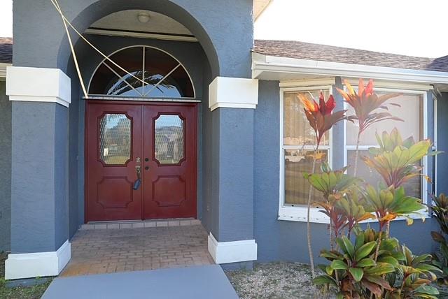 242 Southwest Parish Terrace Port St. Lucie, FL 34984 - Photo 2 of 14 a view of front door of house