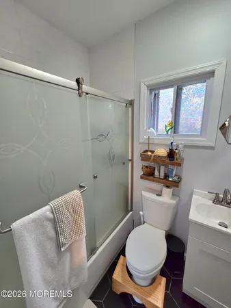 a bathroom with a toilet and a sink