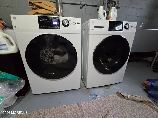 a utility room with dryer and washer
