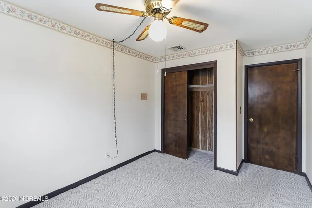 a view of a room with an entryway