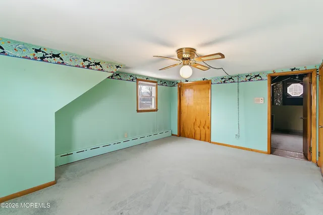 an empty room with windows and flowerpot