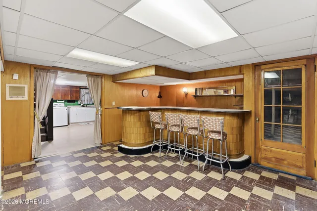 a view of a refrigerator in kitchen and dining room