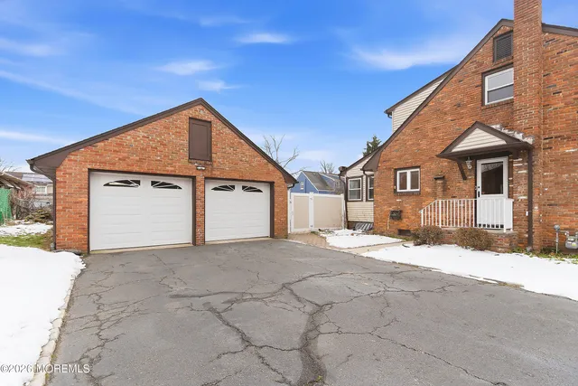 a view of a house with a snow in the yard
