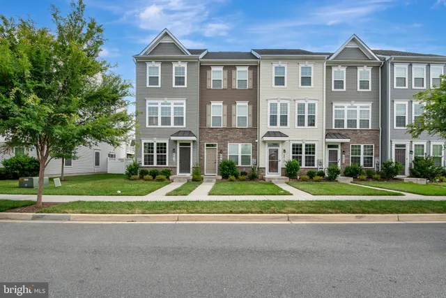 a view of a building next to a yard