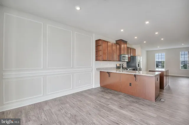 a kitchen with a sink microwave and cabinets