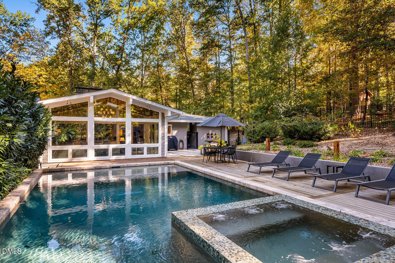 1812 Rolling Road Chapel Hill, NC 27514 - Photo 1 of 72 a view of house with swimming pool and outdoor seating