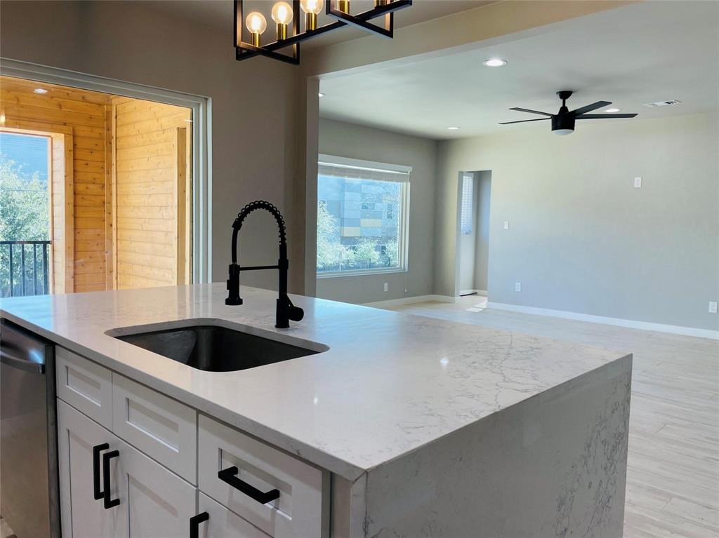4609 Virginia Avenue, Unit 202 Dallas, TX 75204 - Photo 3 of 21 a view of a kitchen counter space a sink and windows