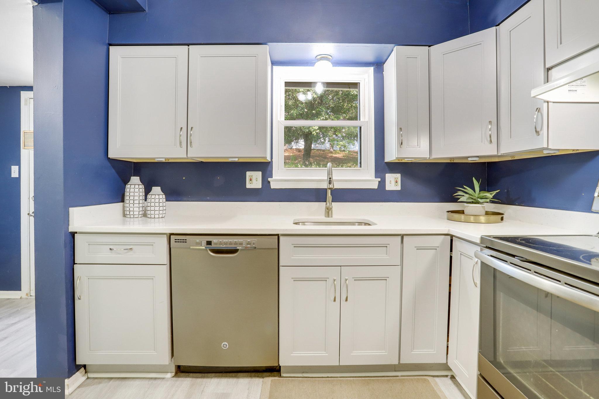 6903 Cherryfield Road Fort Washington, MD 20744 - Photo 13 of 58 a kitchen with a sink cabinets and a window