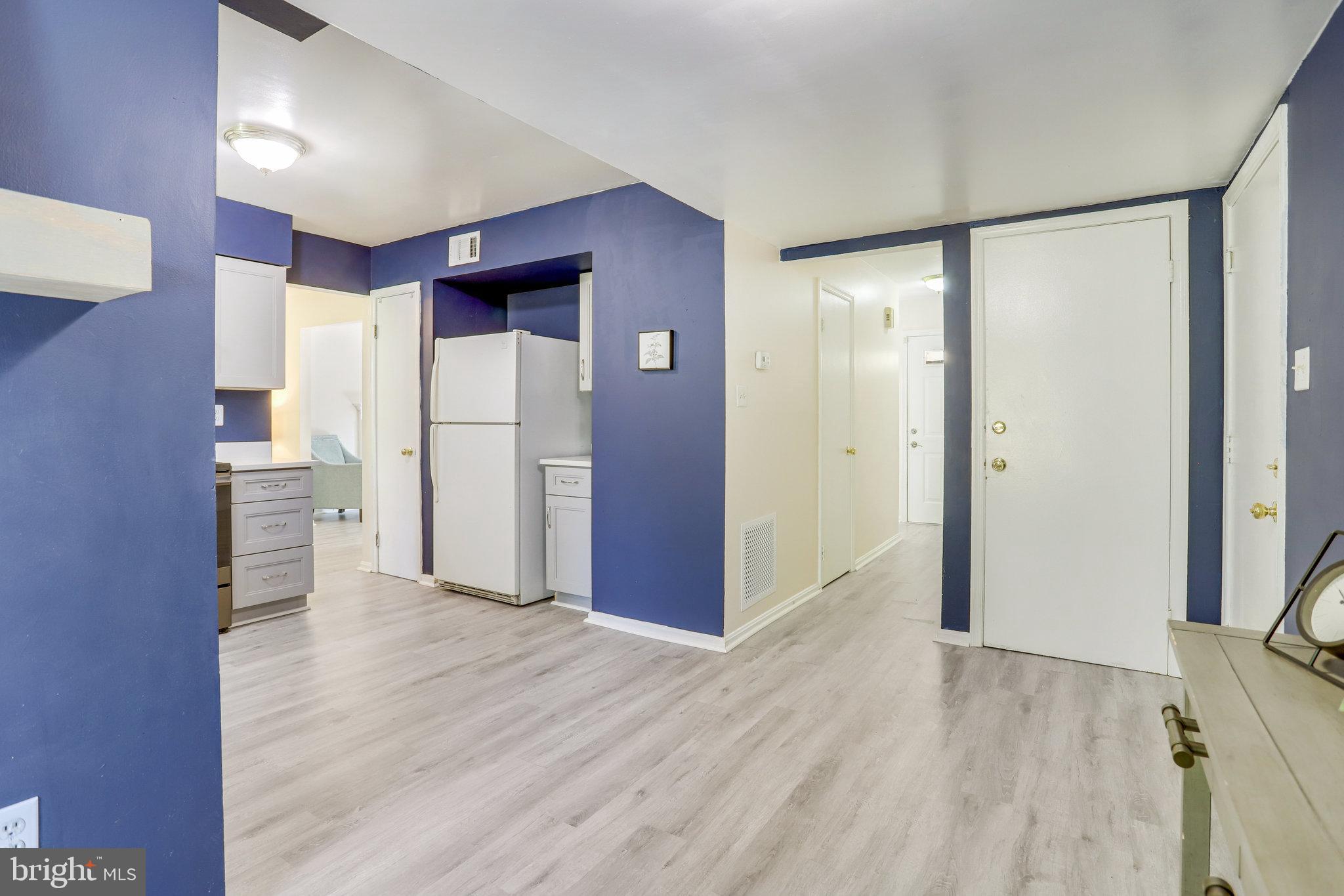 6903 Cherryfield Road Fort Washington, MD 20744 - Photo 19 of 58 a view of a hallway with wooden floor and closet area
