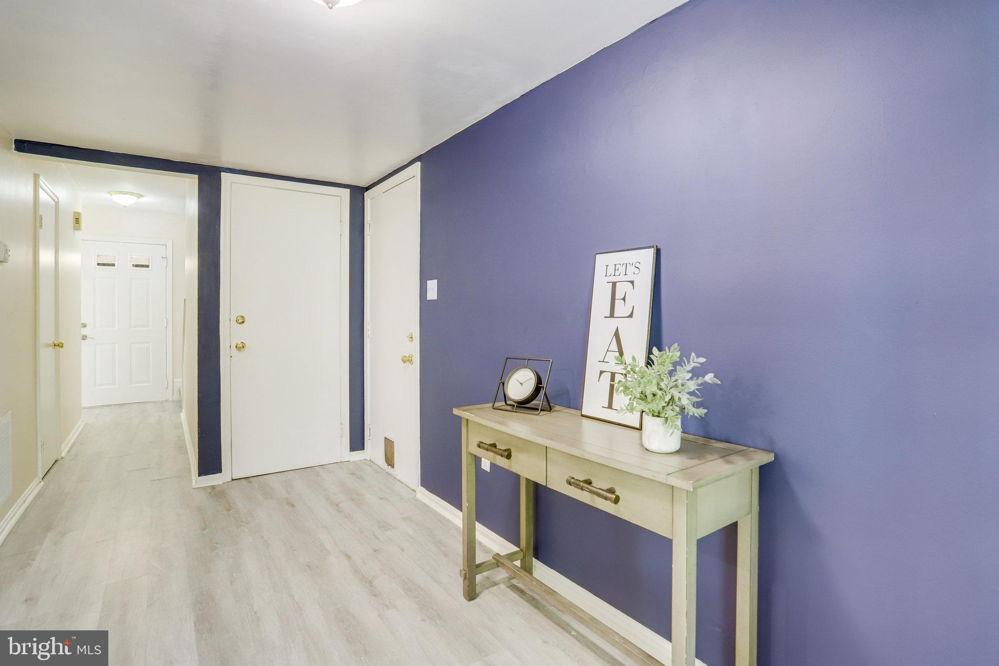 6903 Cherryfield Road Fort Washington, MD 20744 - Photo 20 of 58 a room with a stove and a table