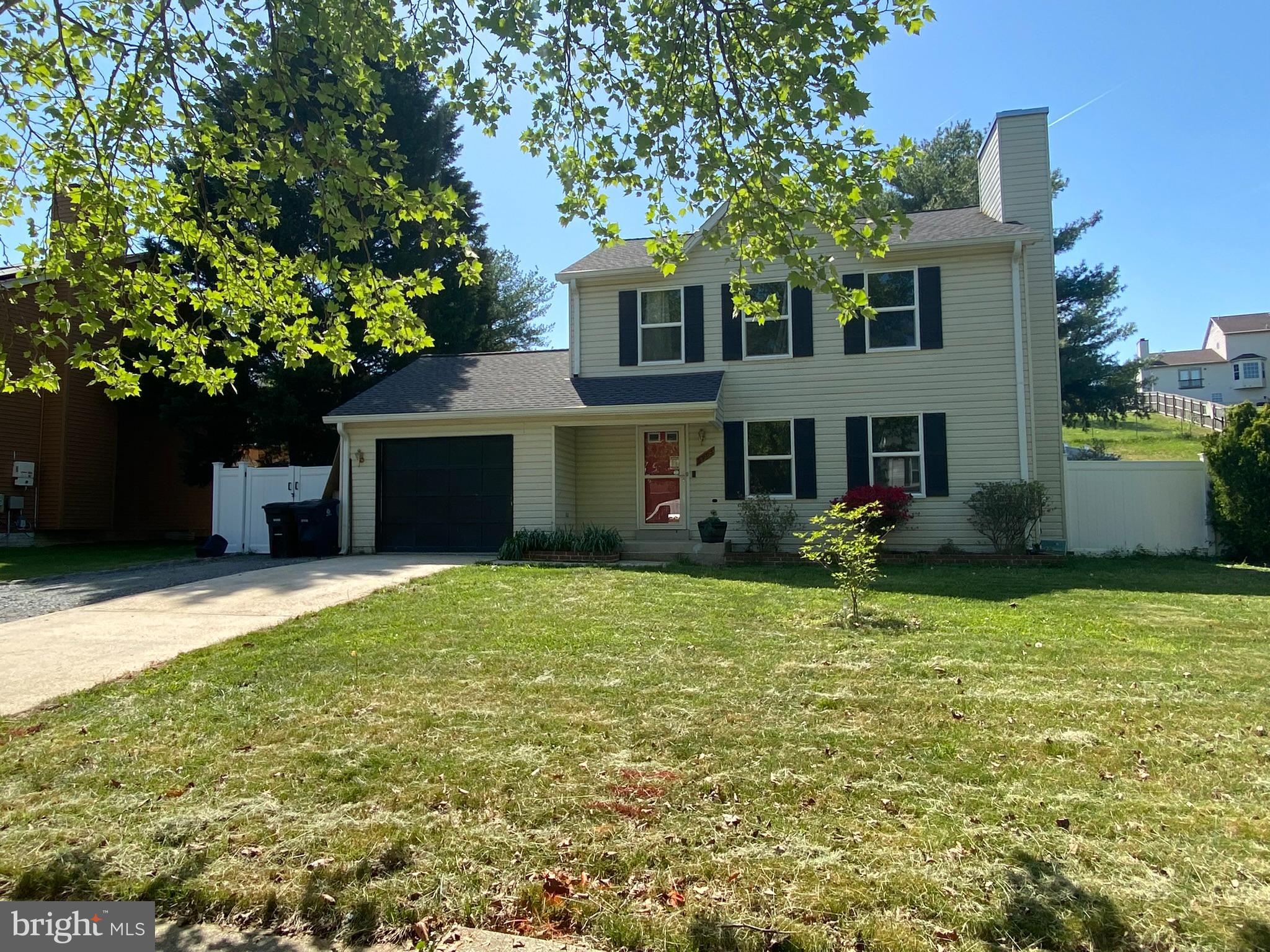 6903 Cherryfield Road Fort Washington, MD 20744 - Photo 2 of 58 a front view of a house with a garden