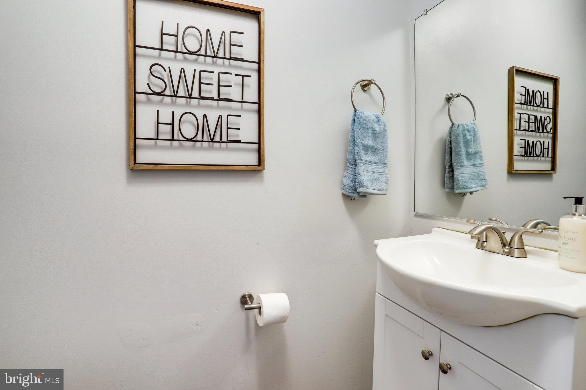 6903 Cherryfield Road Fort Washington, MD 20744 - Photo 23 of 58 a bathroom with a sink and a mirror