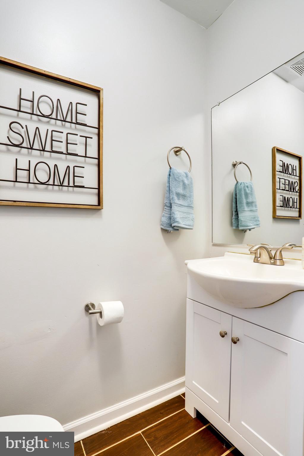 6903 Cherryfield Road Fort Washington, MD 20744 - Photo 24 of 58 a bathroom with a sink and a mirror