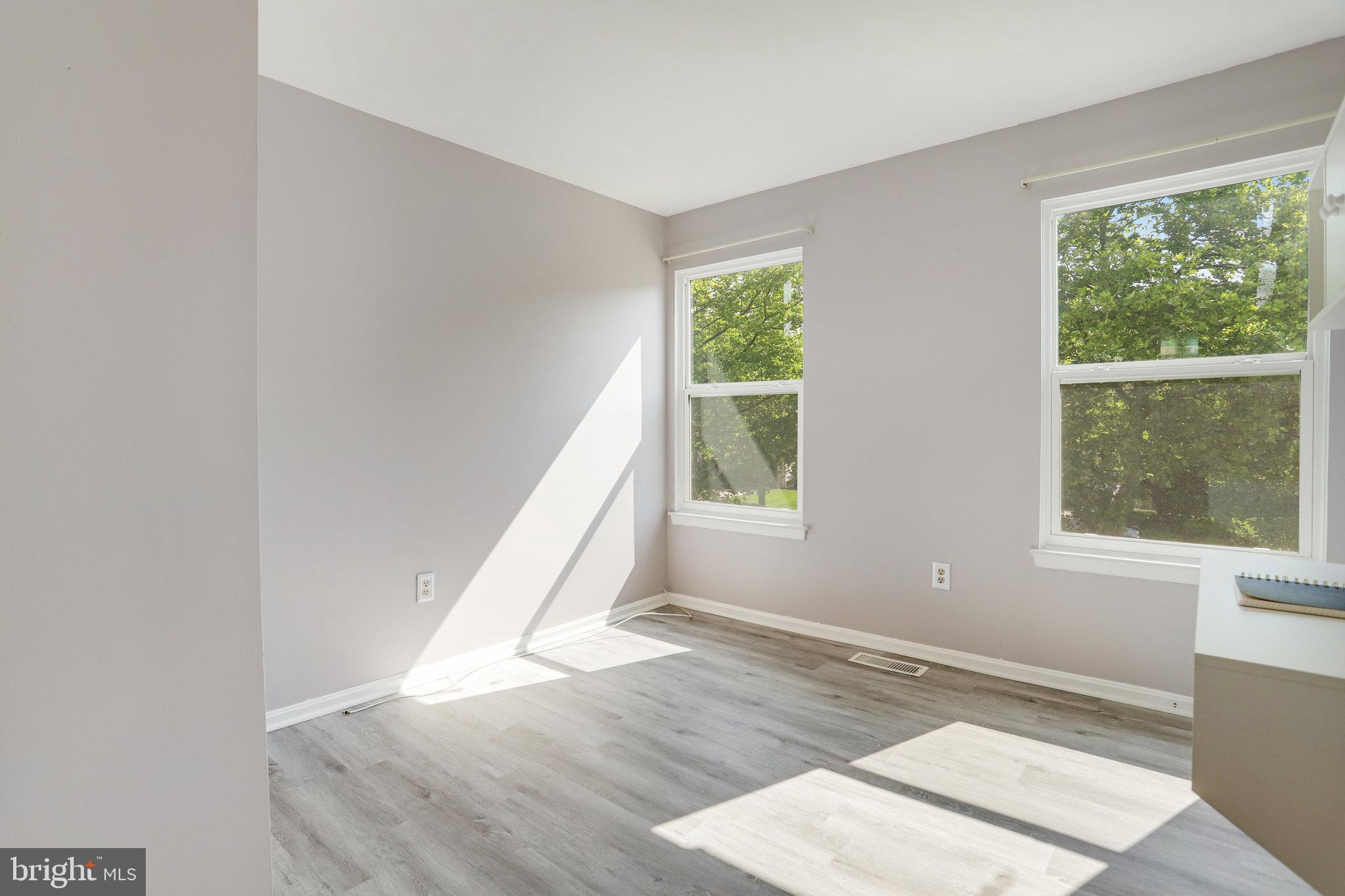 6903 Cherryfield Road Fort Washington, MD 20744 - Photo 25 of 58 an empty room with wooden floor and windows