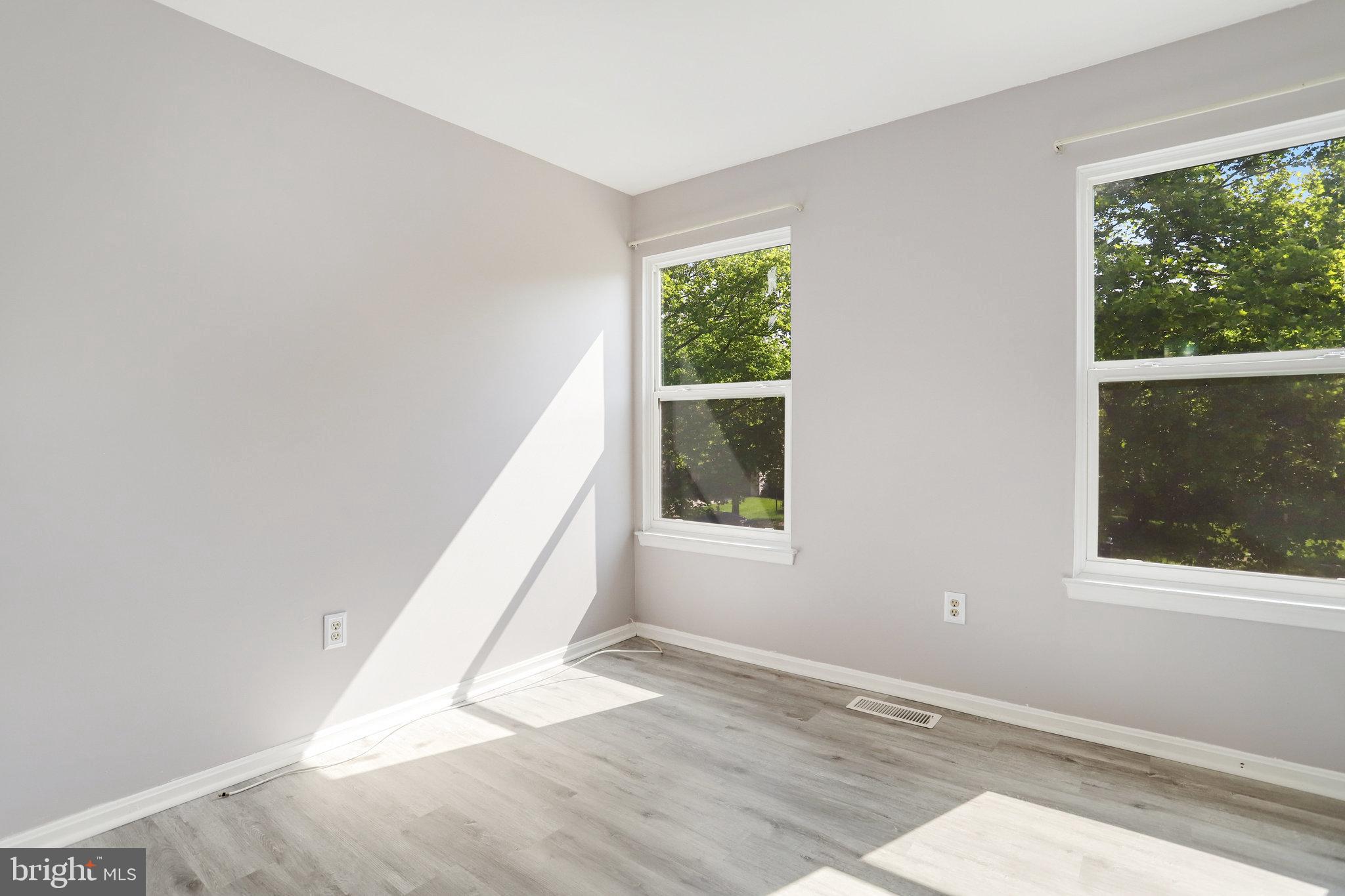6903 Cherryfield Road Fort Washington, MD 20744 - Photo 26 of 58 an empty room with wooden floor and windows