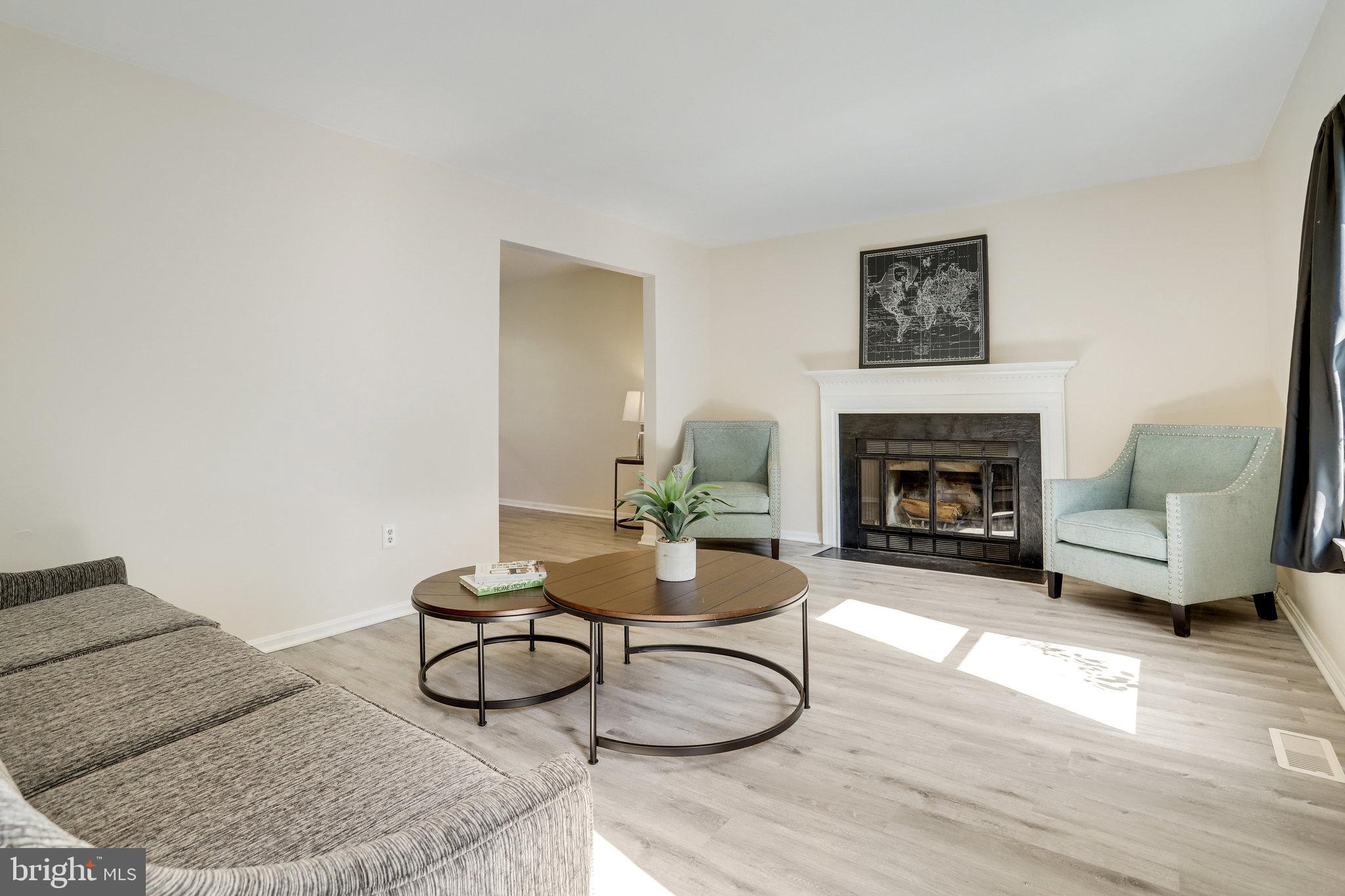 6903 Cherryfield Road Fort Washington, MD 20744 - Photo 3 of 58 a living room with furniture and a fireplace