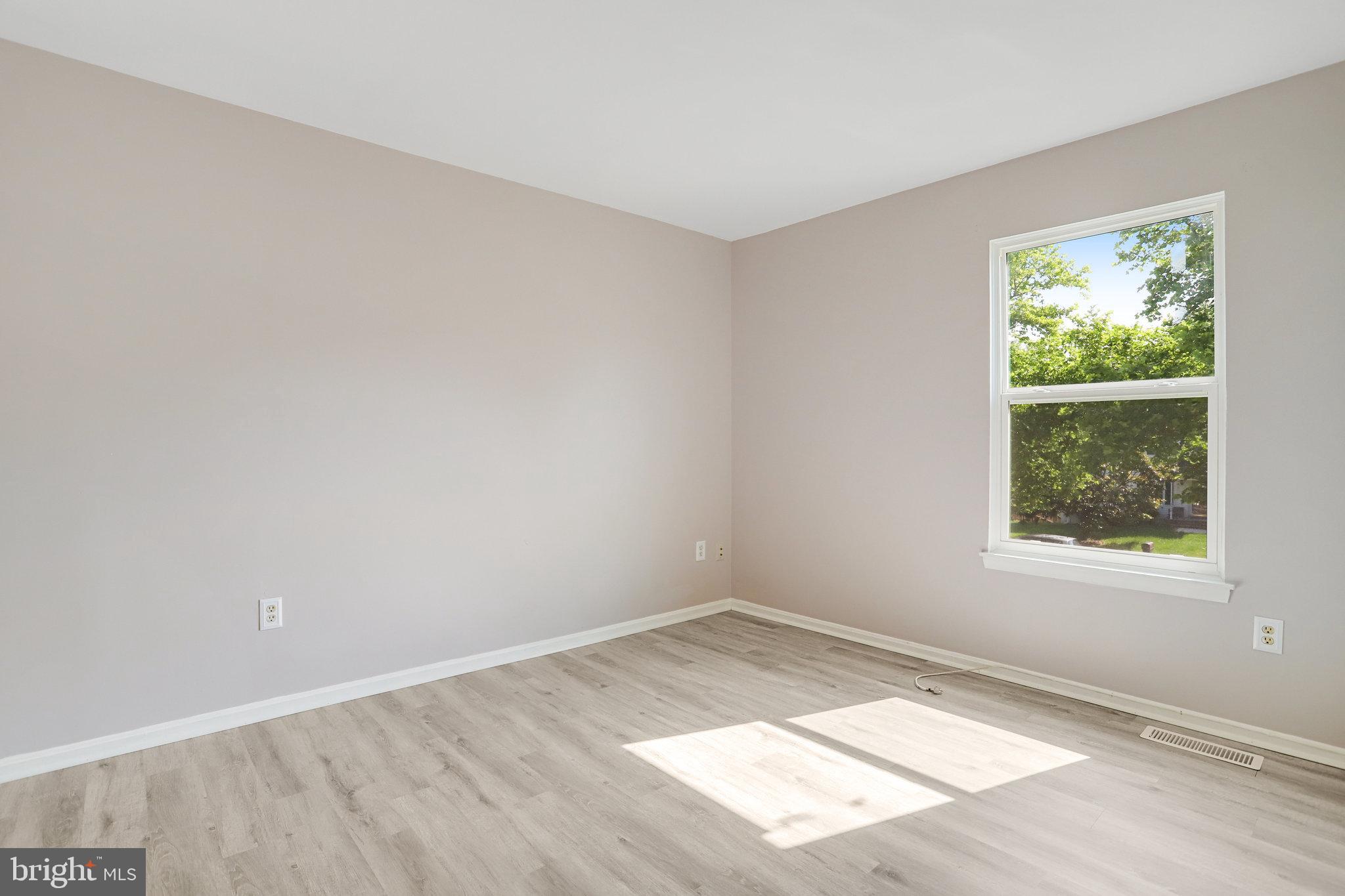 6903 Cherryfield Road Fort Washington, MD 20744 - Photo 31 of 58 an empty room with wooden floor and windows
