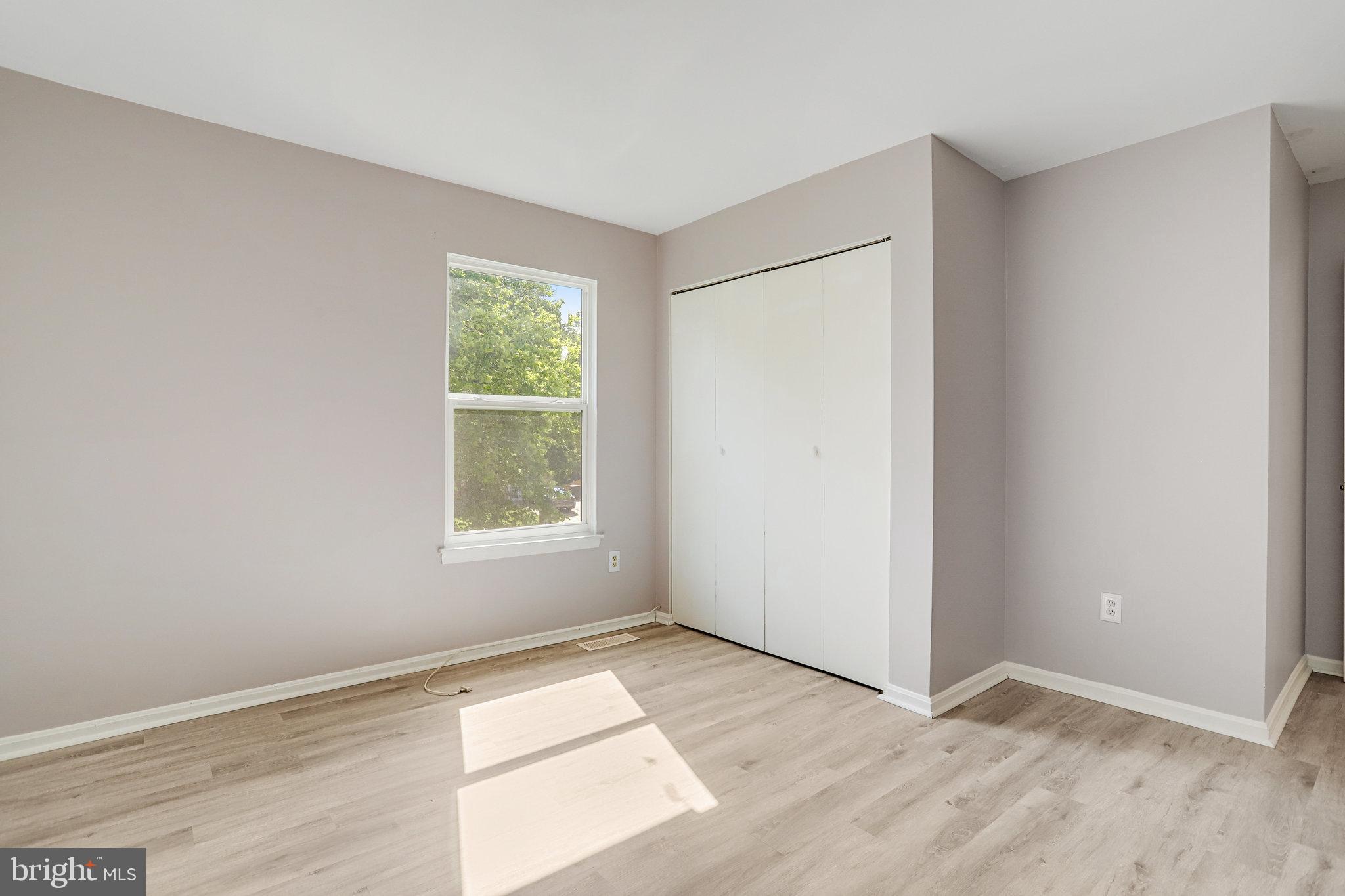 6903 Cherryfield Road Fort Washington, MD 20744 - Photo 32 of 58 an empty room with wooden floor and windows