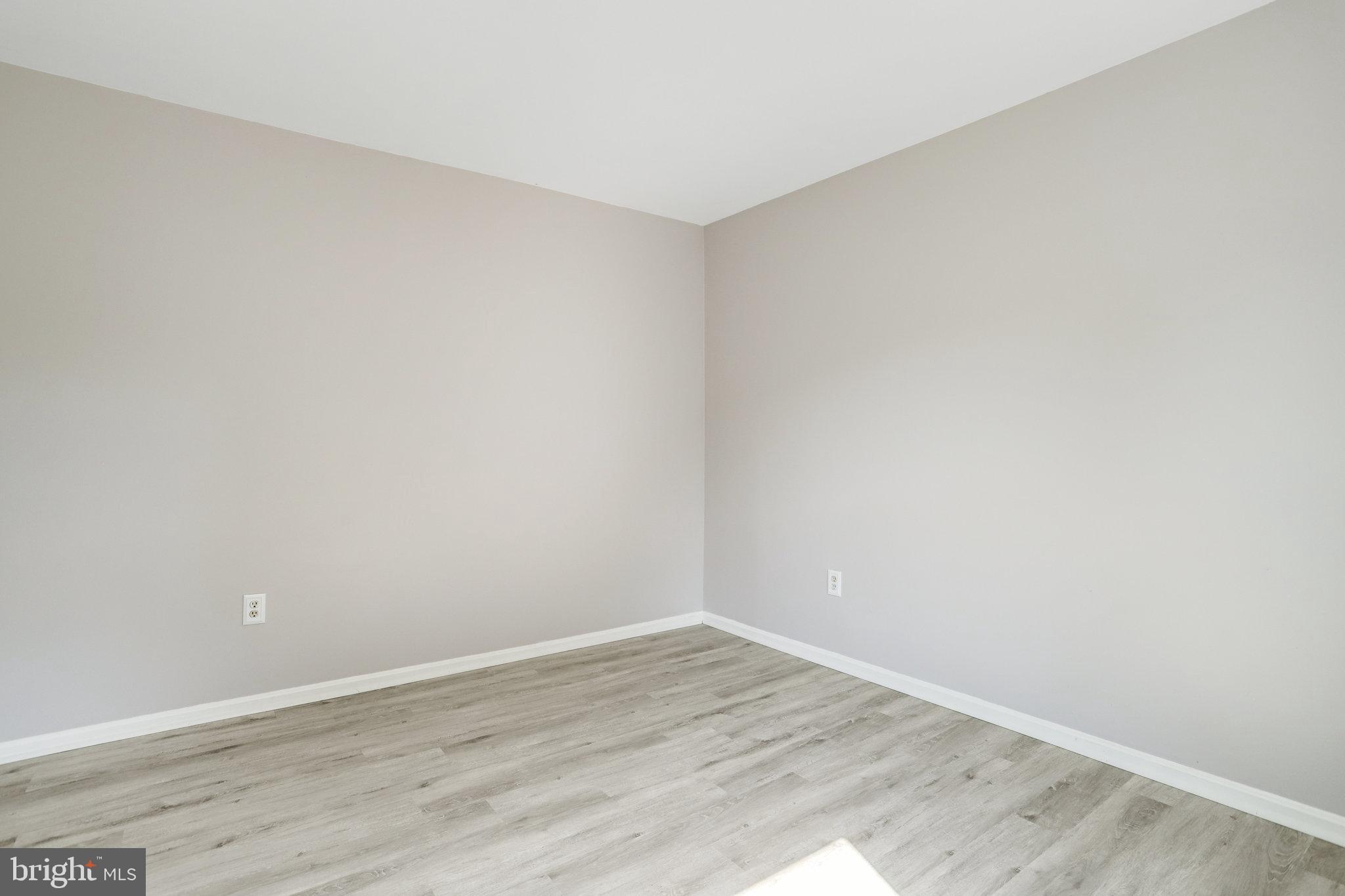 6903 Cherryfield Road Fort Washington, MD 20744 - Photo 34 of 58 a view of an empty room with wooden floor