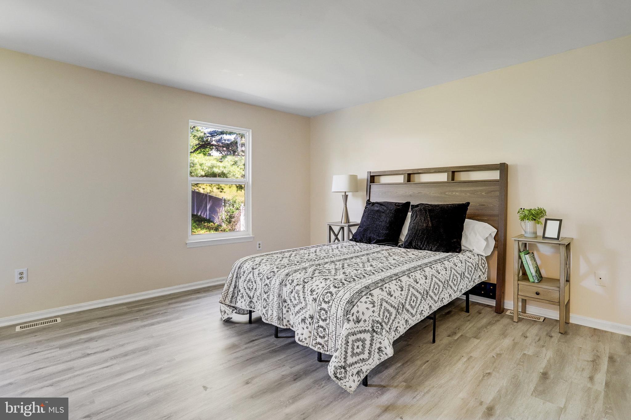 6903 Cherryfield Road Fort Washington, MD 20744 - Photo 35 of 58 a bedroom with a bed and a window