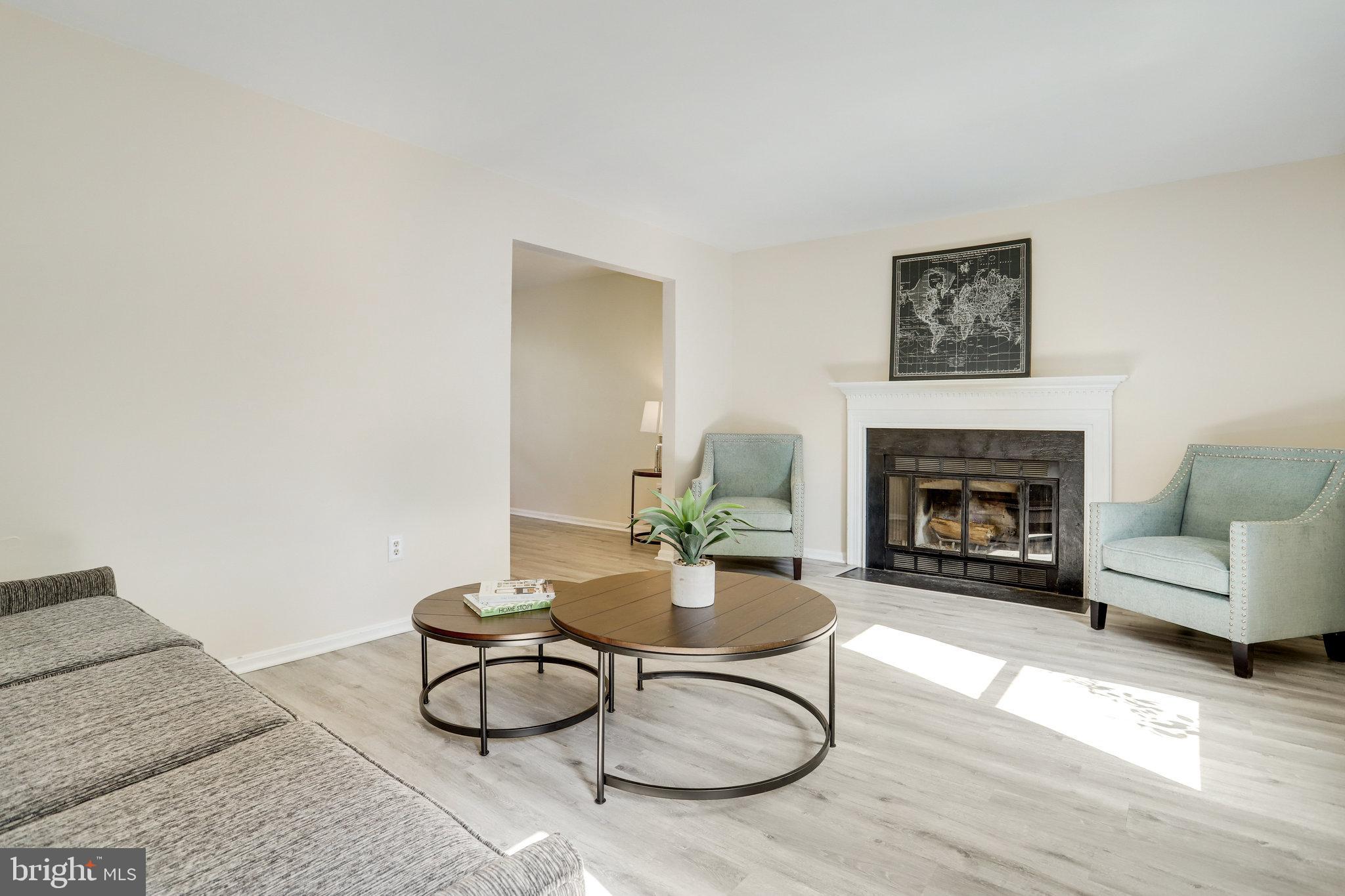 6903 Cherryfield Road Fort Washington, MD 20744 - Photo 4 of 58 a living room with furniture and a fireplace