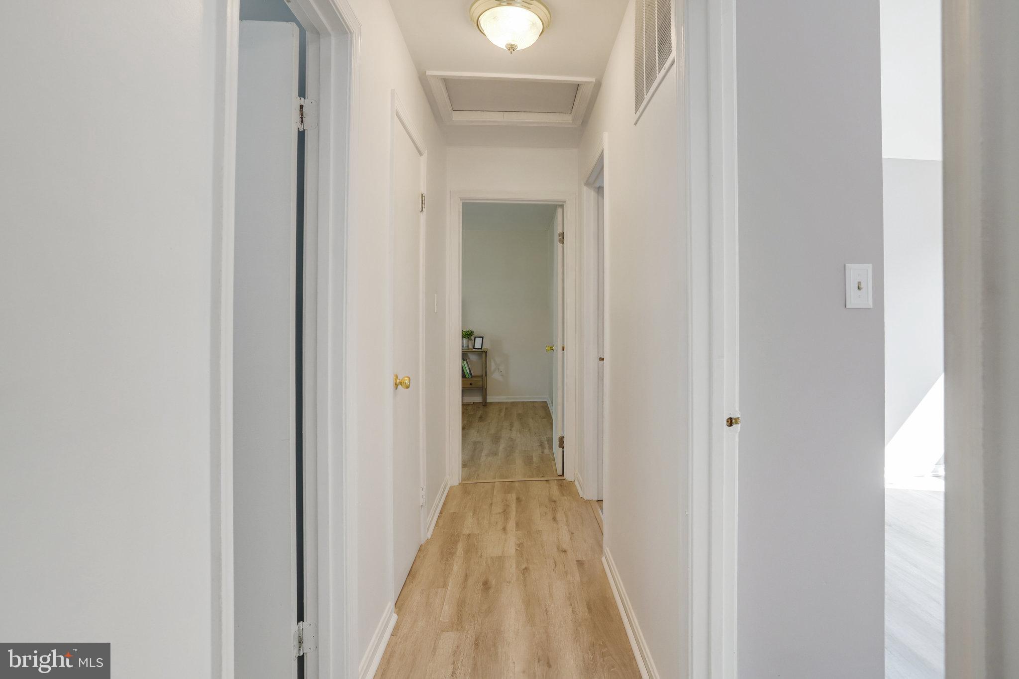 6903 Cherryfield Road Fort Washington, MD 20744 - Photo 44 of 58 a view of a bathroom from a hallway