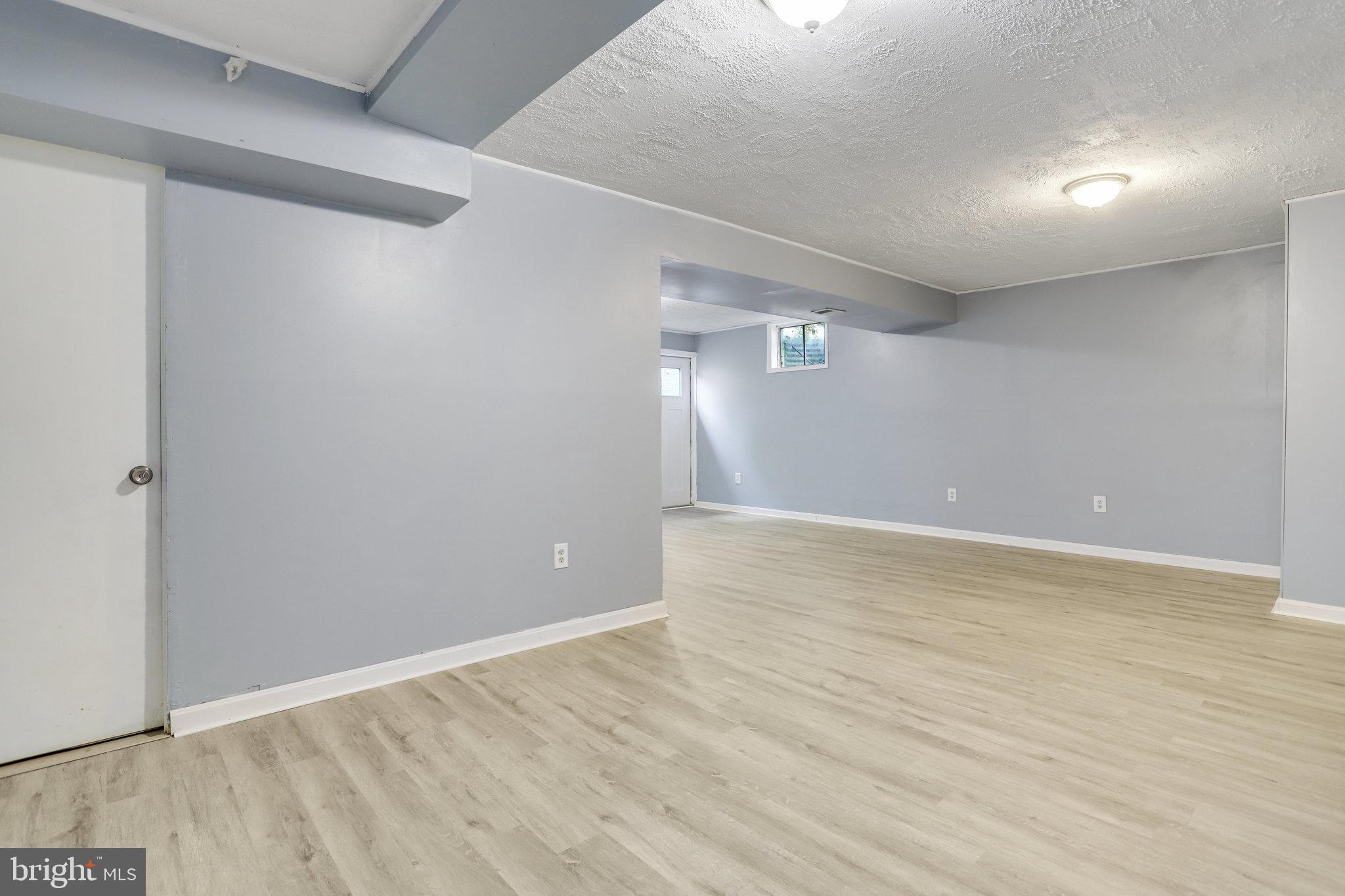 6903 Cherryfield Road Fort Washington, MD 20744 - Photo 49 of 58 a view of an empty room with wooden floor