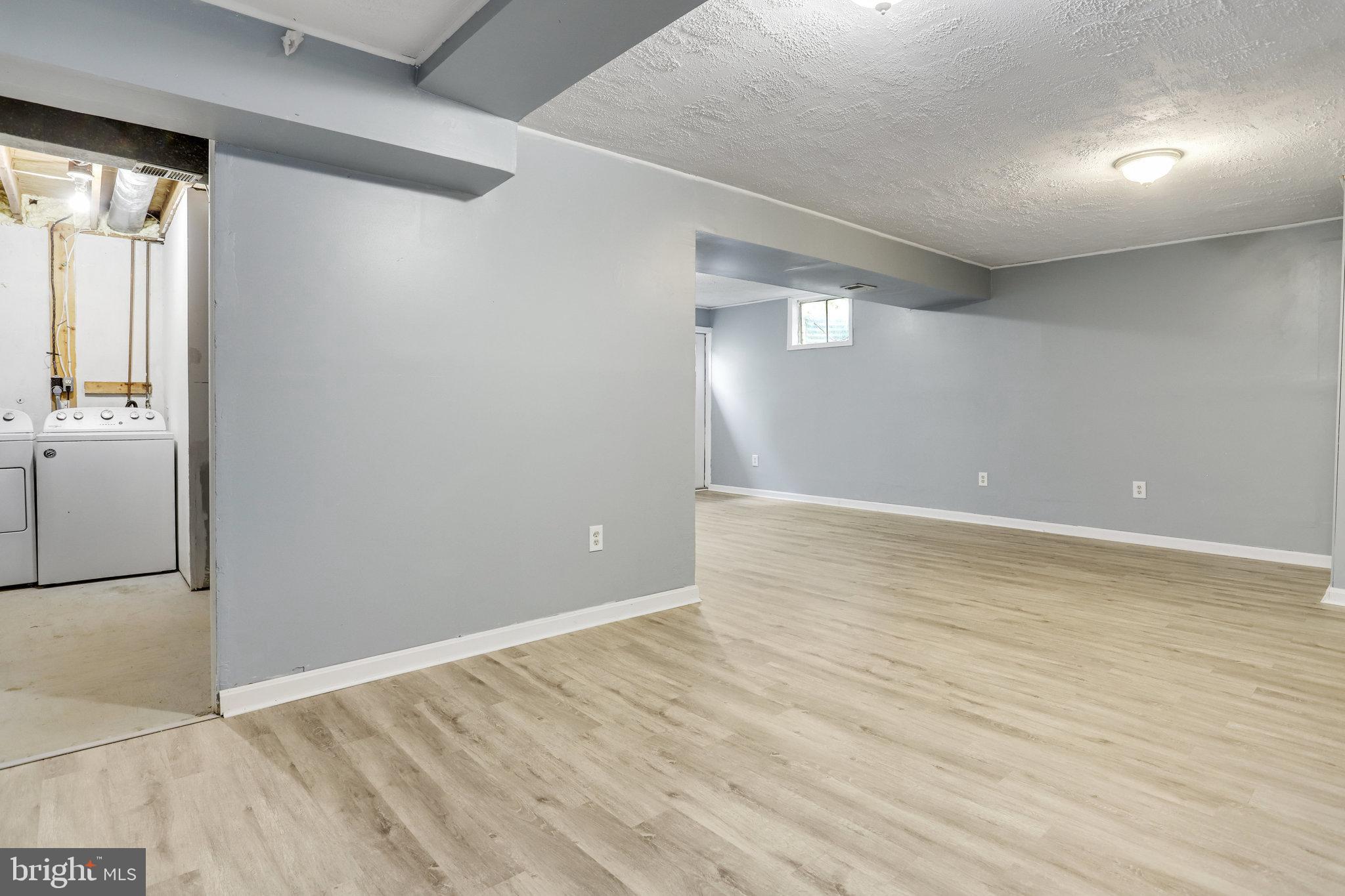 6903 Cherryfield Road Fort Washington, MD 20744 - Photo 50 of 58 wooden floor in an empty room with a window
