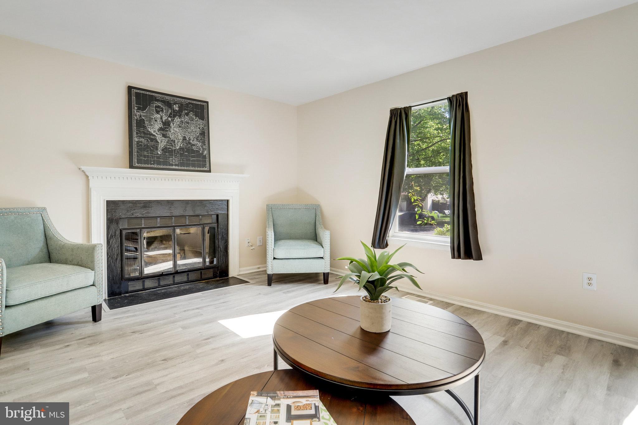 6903 Cherryfield Road Fort Washington, MD 20744 - Photo 5 of 58 a living room with furniture and a fireplace