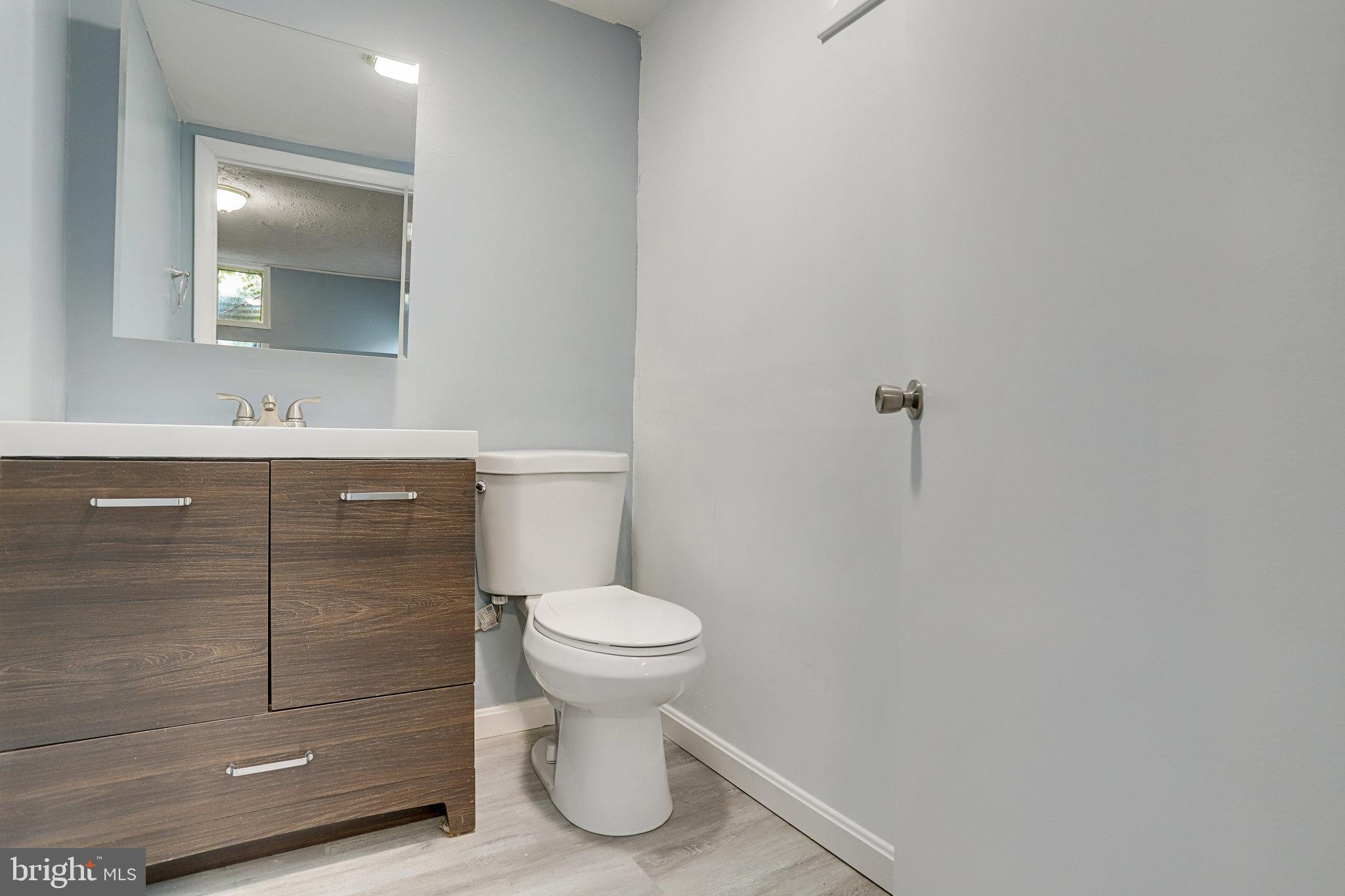 6903 Cherryfield Road Fort Washington, MD 20744 - Photo 51 of 58 a bathroom with a sink a toilet and a mirror
