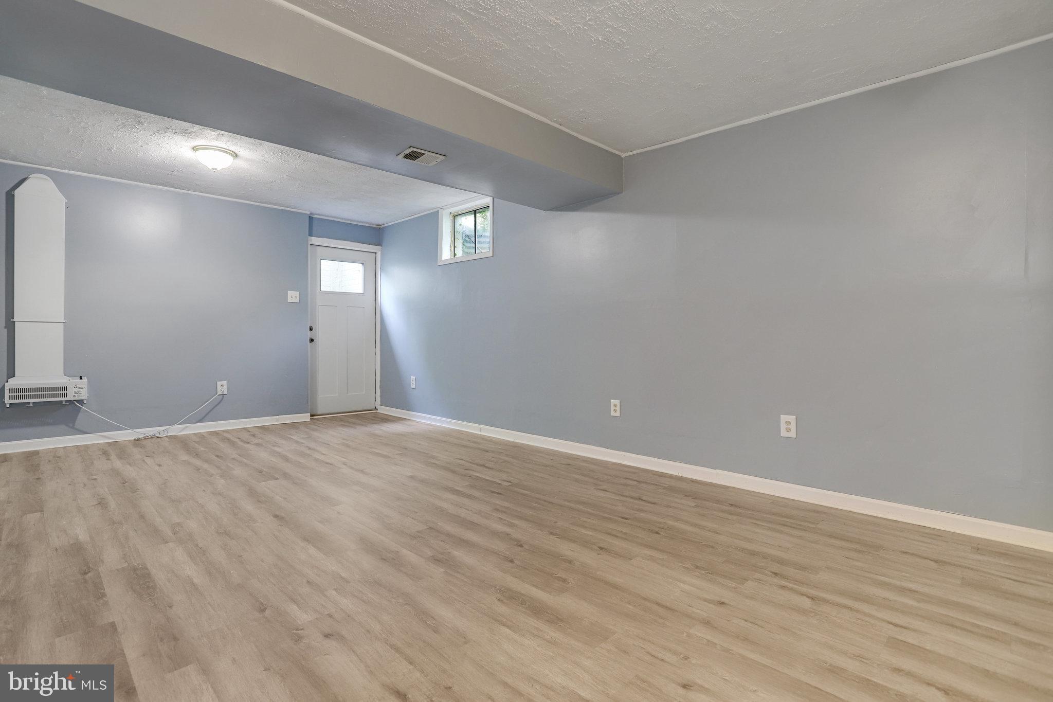 6903 Cherryfield Road Fort Washington, MD 20744 - Photo 53 of 58 an empty room with wooden floor and windows