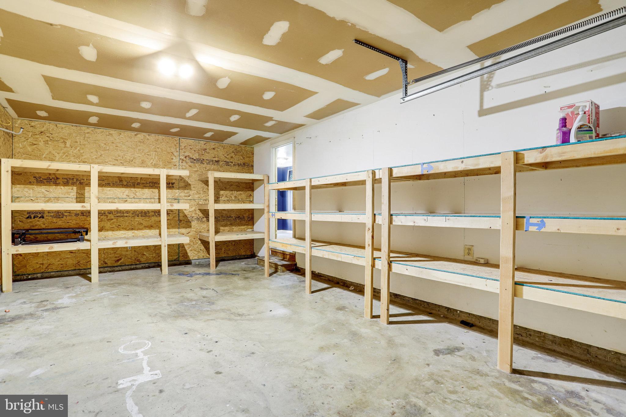 6903 Cherryfield Road Fort Washington, MD 20744 - Photo 57 of 58 a view of an empty room with empty shelves