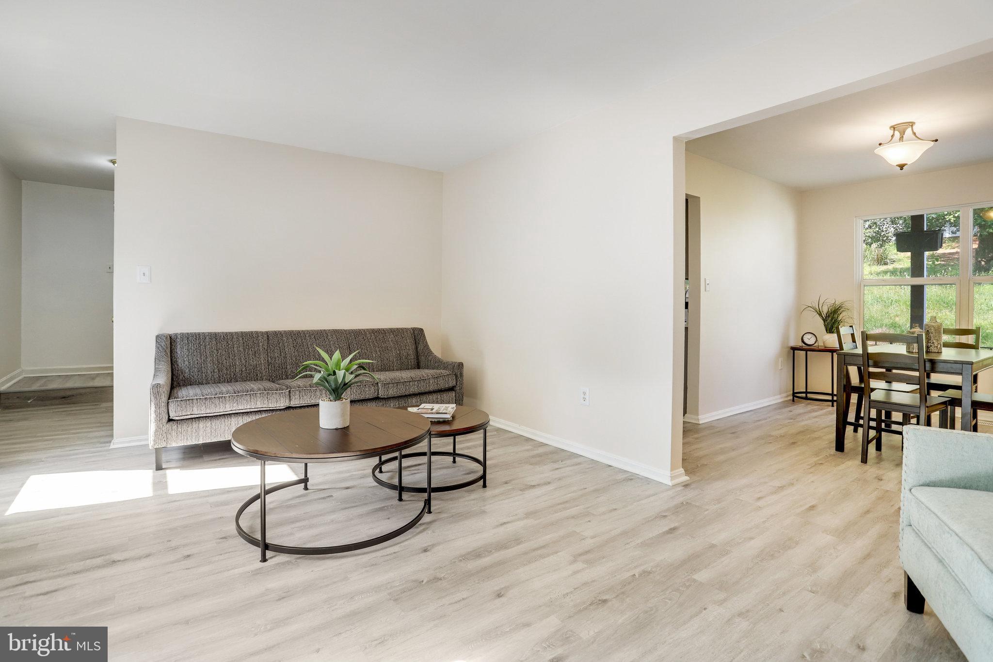 6903 Cherryfield Road Fort Washington, MD 20744 - Photo 6 of 58 a living room with furniture and wooden floor
