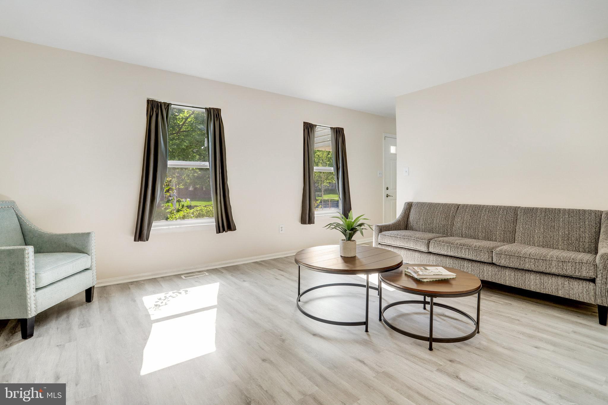 6903 Cherryfield Road Fort Washington, MD 20744 - Photo 7 of 58 a living room with furniture and a window