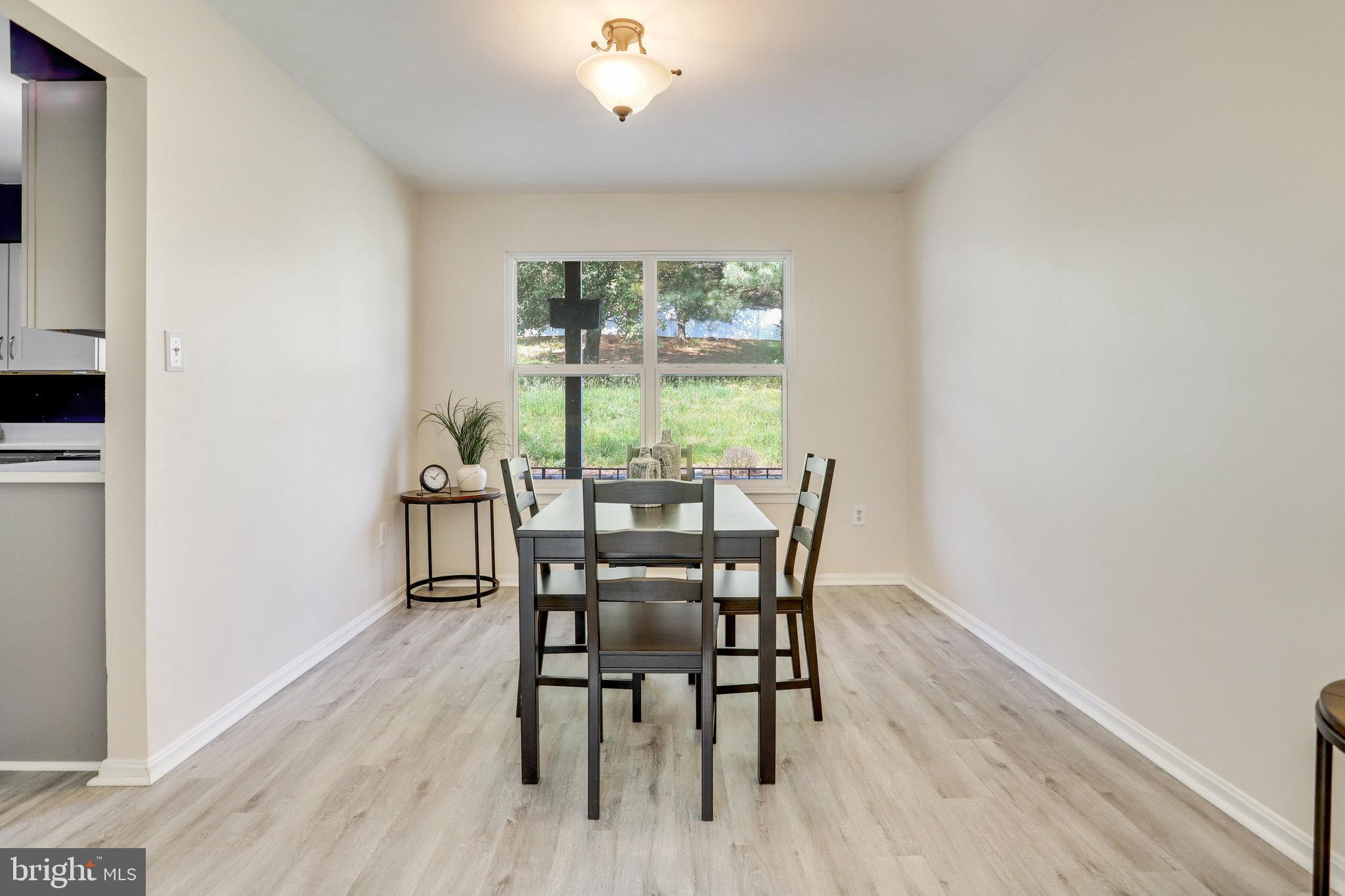 6903 Cherryfield Road Fort Washington, MD 20744 - Photo 9 of 58 a view of a dining room with furniture window and outside view