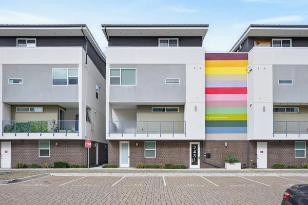 a view of multiple houses with a street