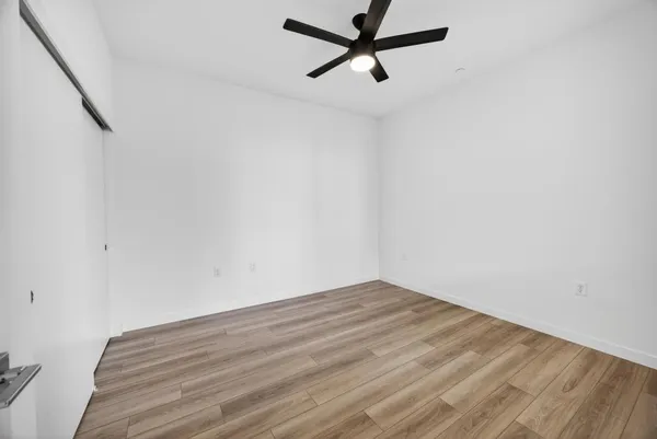 a view of a big room with wooden floor