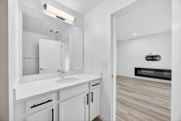a bathroom with a sink and a mirror