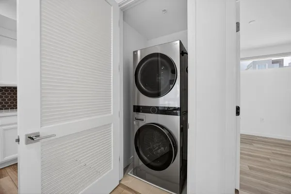 a view of a hallway with washer and dryer