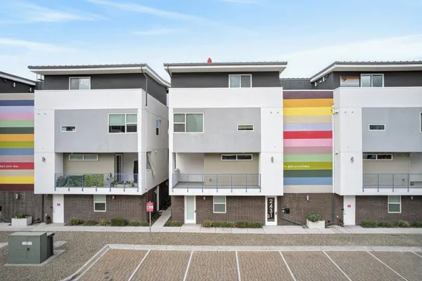 a view of a building with car parked