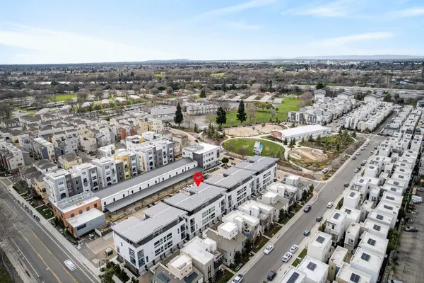 a terrace with outdoor seating and city view